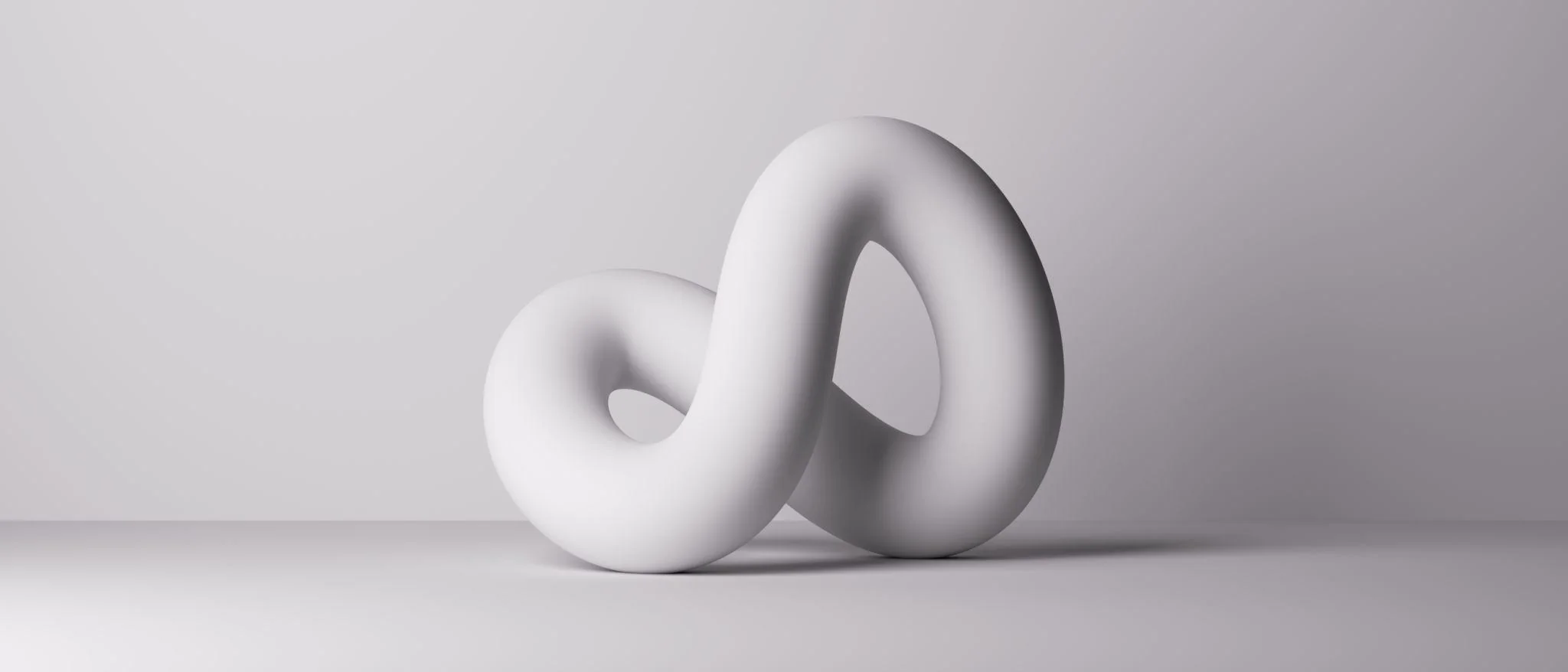 Twisted sculptural ribbon — engineering and marketing woven into one discipline